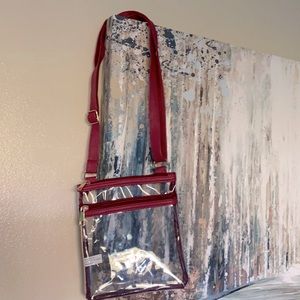 Clear purse with adjustable strap. Great for the airport or a job also in black